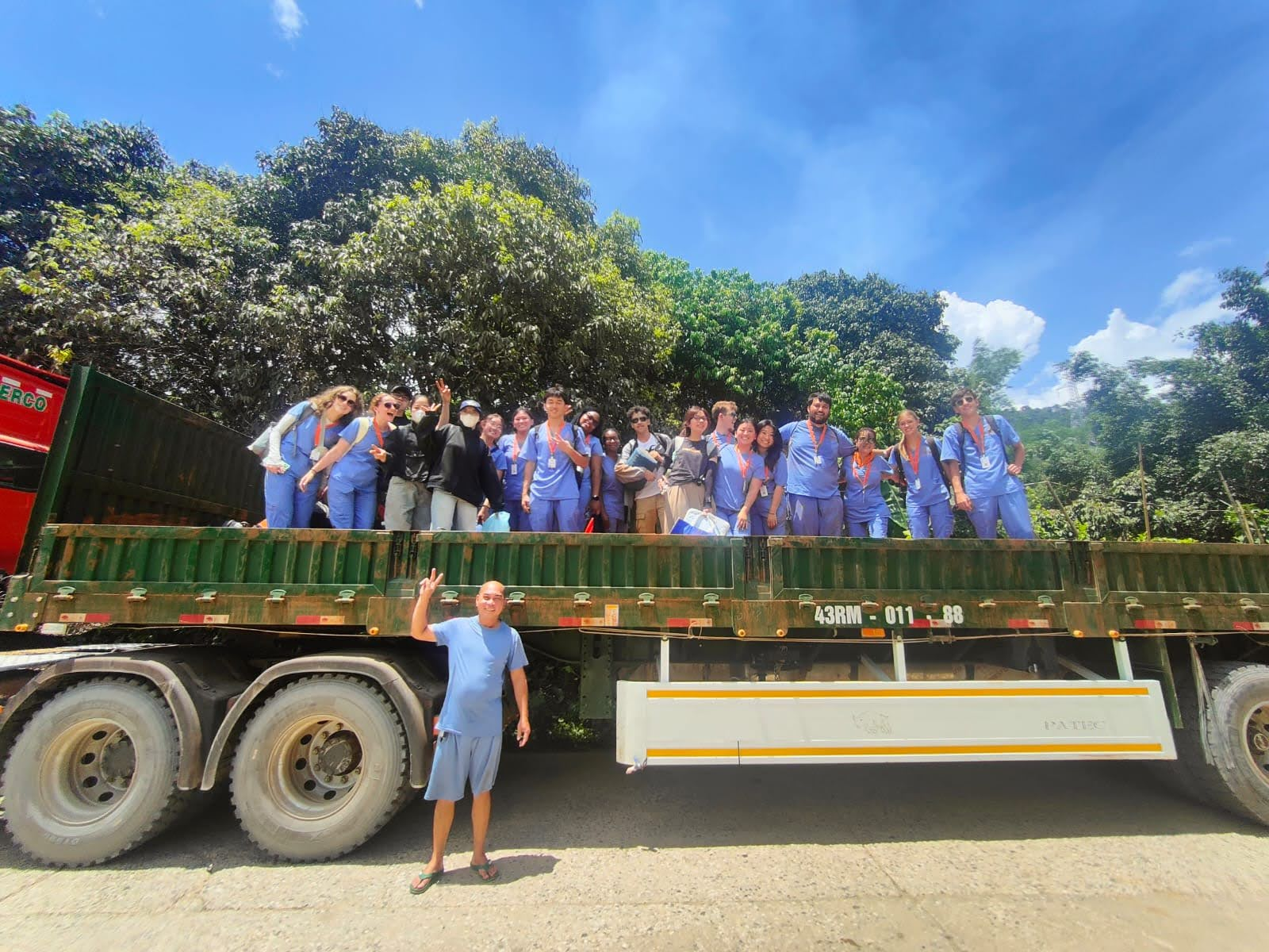 students on a travel award trip in their scrubs on top of a truck